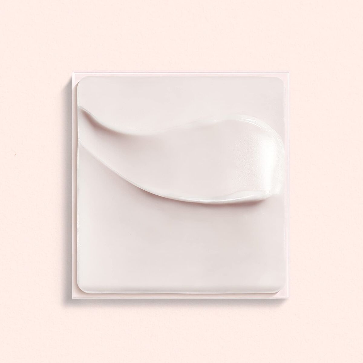Lierac Lift Integral regenerating cream swatch on a soft background, showcasing its smooth texture and premium quality.