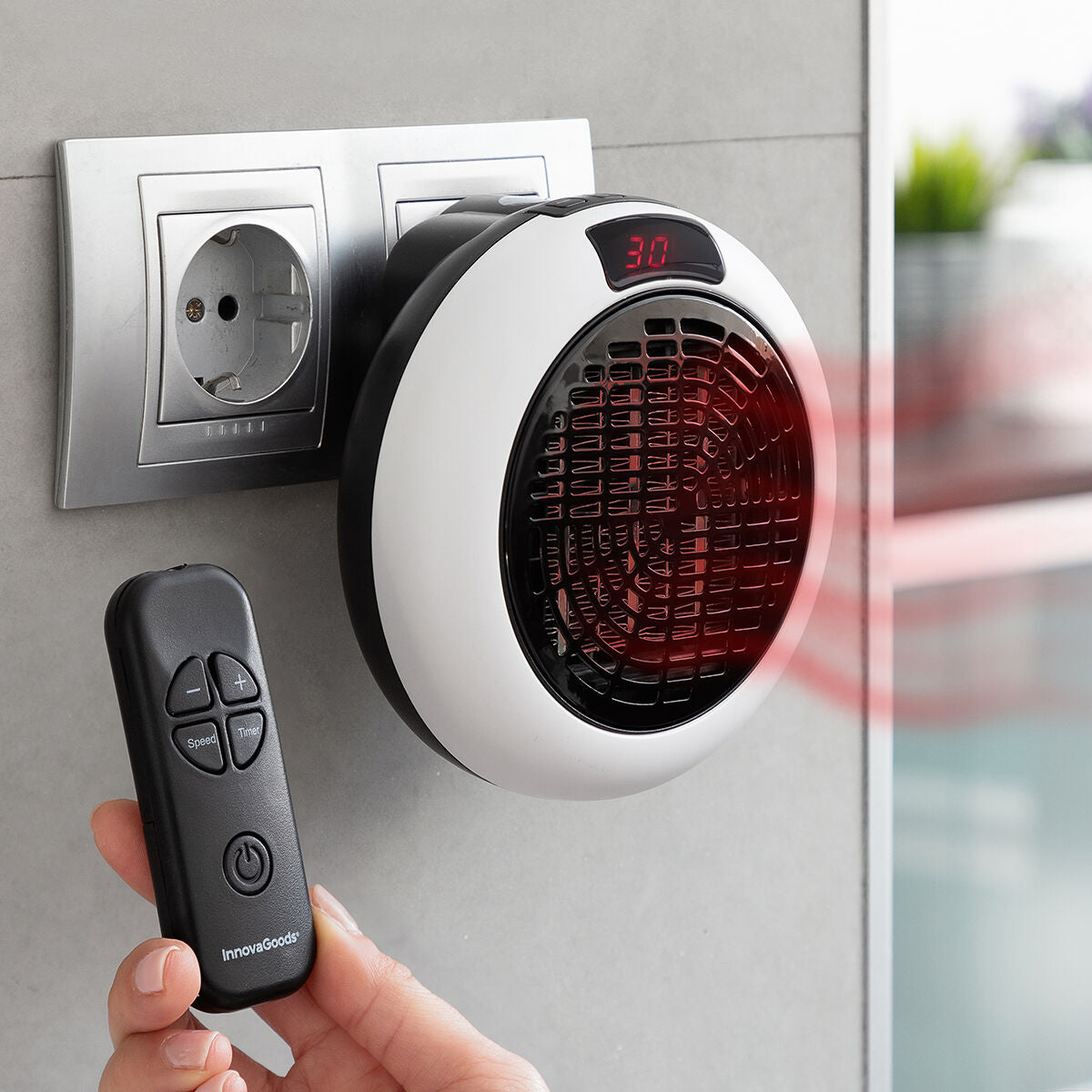 Calefactor cerámico con mando a distancia InnovaGoods, ideal para calentar espacios con control remoto y diseño innovador.