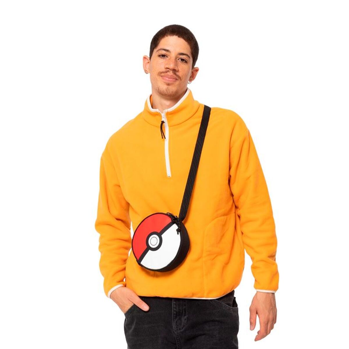 Eastpak Ada Pokemon Ball messenger bag worn by a model in a bright orange jacket.
