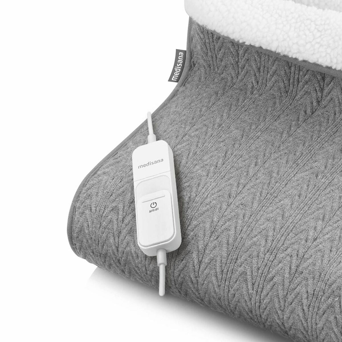 Calientapiés Medisana gris con controlador en un fondo gris suave, ideal para el confort térmico.