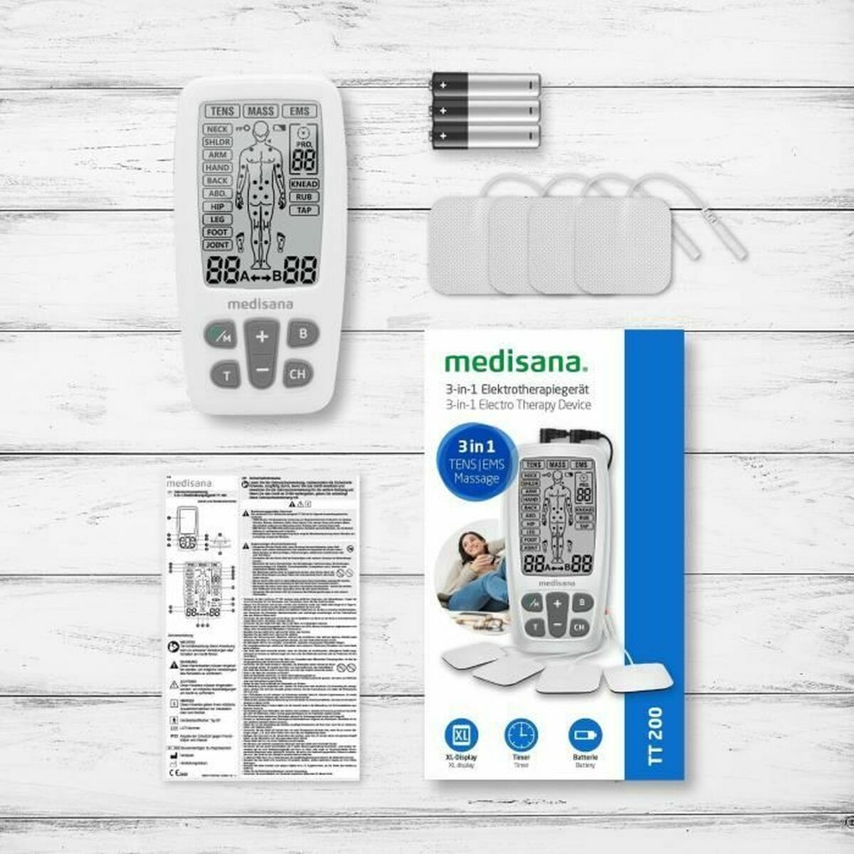 Electroestimulador muscular Medisana en caja con control remoto y electrodos para terapia y masaje en casa.