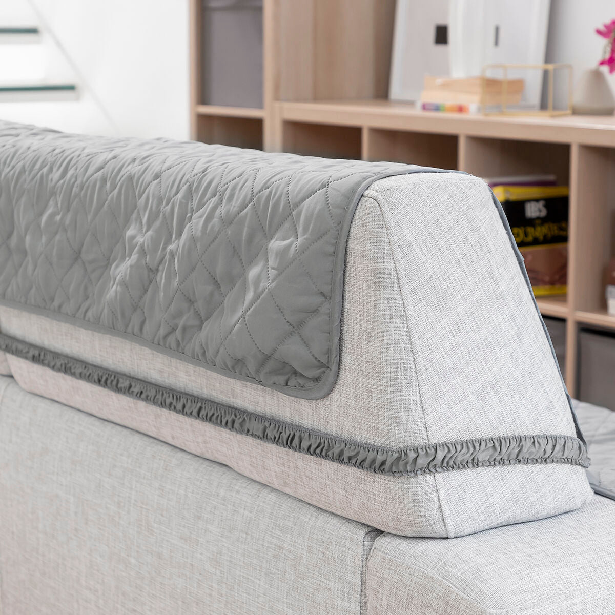Reversible sofa protector cover in modern grey, designed for 3-seater sofas, offering style and protection.